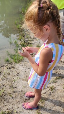 Picture of Hadley and her first fish.