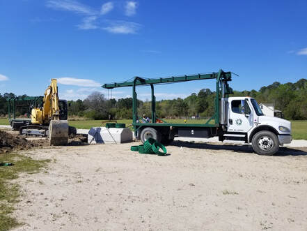 Picture of installation of step/pump septic tank for the office area.